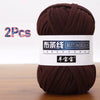 A skein of dark brown soft chunky t-shirt yarn labeled as Butiaoxian Yangbaobao, packaged as a 2-pack.