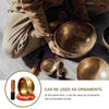 Handcrafted Tibetan singing bowl with silk cushion and mallet shown in use.