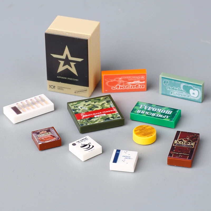 A collection of mini building blocks in various colors and shapes including a star block, orange, green, yellow, and brown.