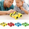 A collection of yellow, red, blue, and green four-wheel drive stunt cars with pull-back action toys.