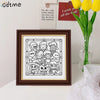 A framed black and white line art illustration of several cute, spooky-themed characters for a coloring book.