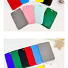 A collection of colorful retractable ID badge holders with keychains and clips arranged on a white background.