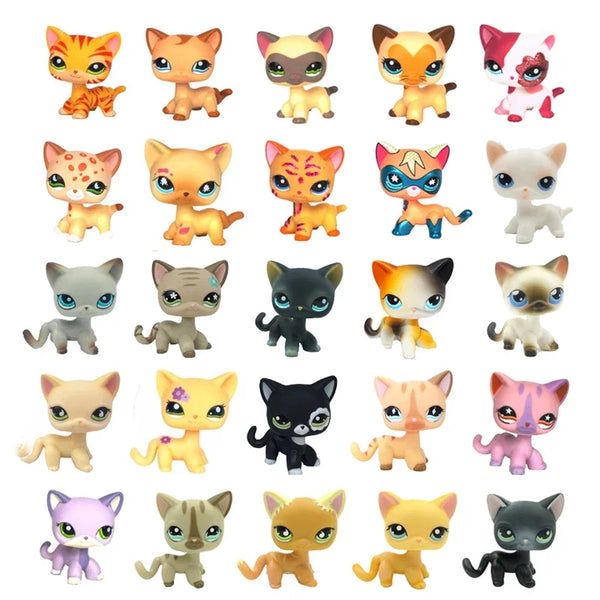 A collection of various collectible pet kitten figures in different colors and poses.