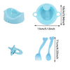 A set of light blue doll feeding and care accessories including a bowl and two spoons.