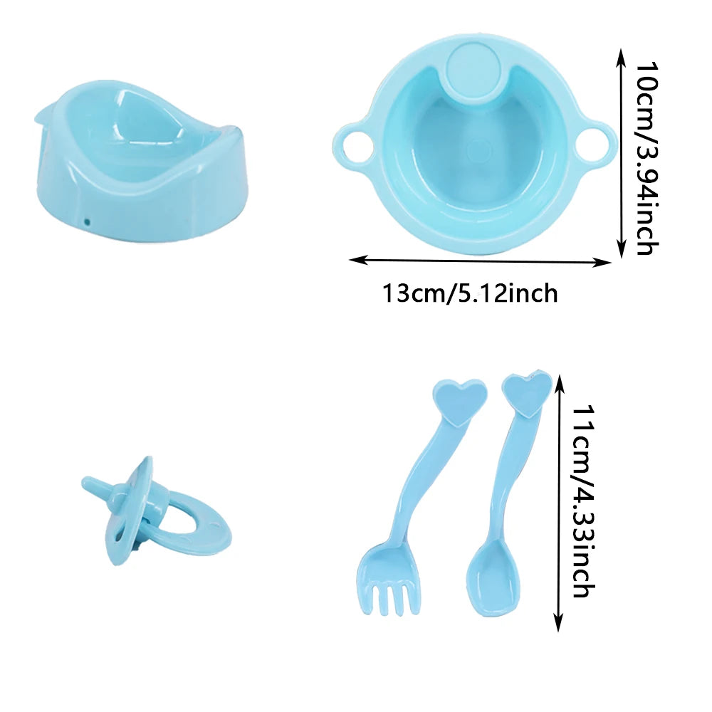 A set of light blue doll feeding and care accessories including a bowl and two spoons.
