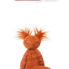 An orange fox plushie with white accents, shown in a close-up view.
