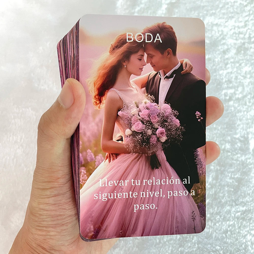 A hand holds a pink oracle card featuring a couple embracing, with text encouraging moving to the next level in a relationshi