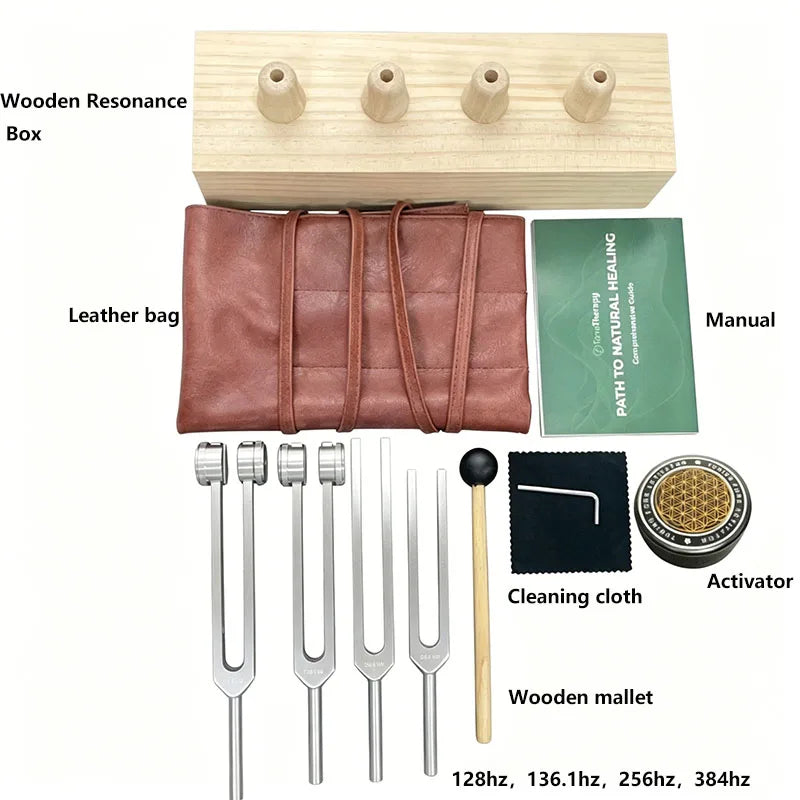 A set of sound healing tuning forks including a wooden resonance box, leather bag, cleaning cloth, and activator.