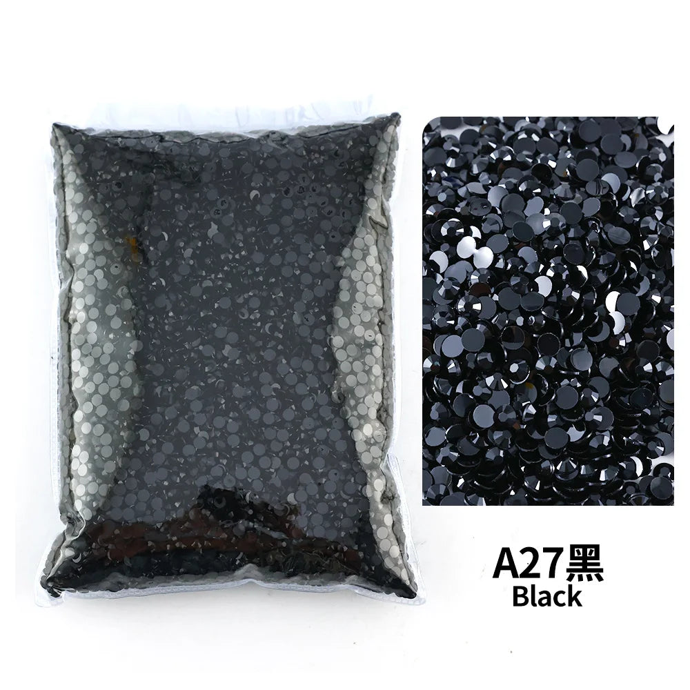 A27 Black flat-back resin rhinestones for DIY craft and nail art, shown in a bag and loose.