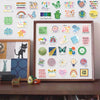 A collection of 50 mental health and positive affirmation stickers featuring various phrases and graphics on a white backgrou
