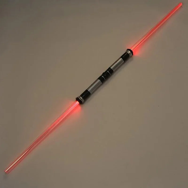 A red lightsaber toy with a glowing blade and a black and silver hilt is shown against a plain background.
