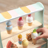 A wooden ice cream counter play set featuring various colorful ice cream treats and cups.