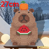 A wooden building block shaped like a bear holding a watermelon, used as a pen holder or desk organizer.