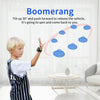 A boy demonstrates a boomerang toy, showing how to tilt and push the device to make it spin and return.