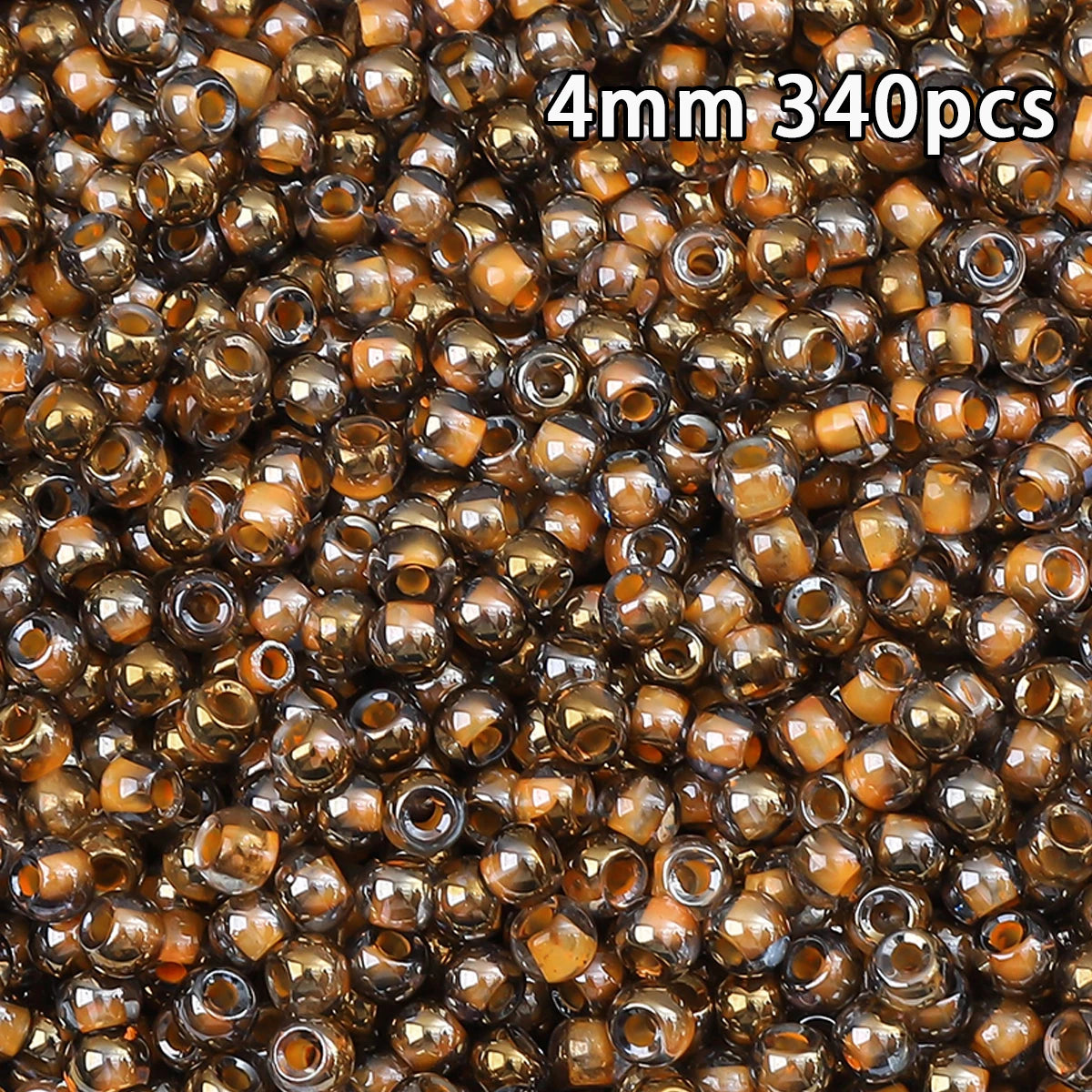 A close-up view of 340 golden gradient glass beads in a pile.