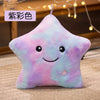 A soft, star-shaped plush pillow with a pastel gradient of pink and blue colors.