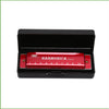 A red harmonica with ten holes is displayed inside its black protective case.