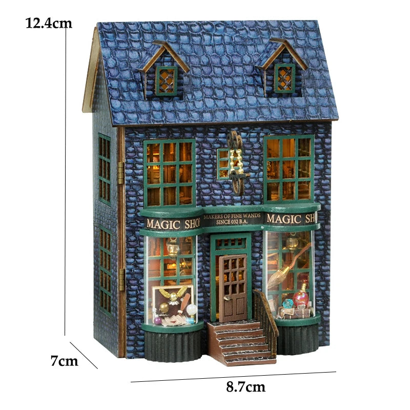 A miniature wooden dollhouse kit of a pink princess villa with LED lights featuring a blue tiled roof and detailed facade.