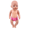 A baby doll with blue eyes wearing pink soft underwear.