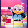 A yellow Minion figure wearing glasses and a suit is shown next to a small pink box.
