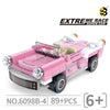 A pink and white police helicopter and SWAT carrier vehicle building blocks set.