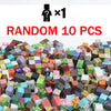 A pile of random magnetic building tiles in various colors and shapes.