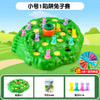 A green puzzle game board shaped like a rabbit, featuring various colored plastic pieces for play.