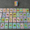 A grid of colorful flash cards featuring various fruits, vegetables, and food items for early learning.