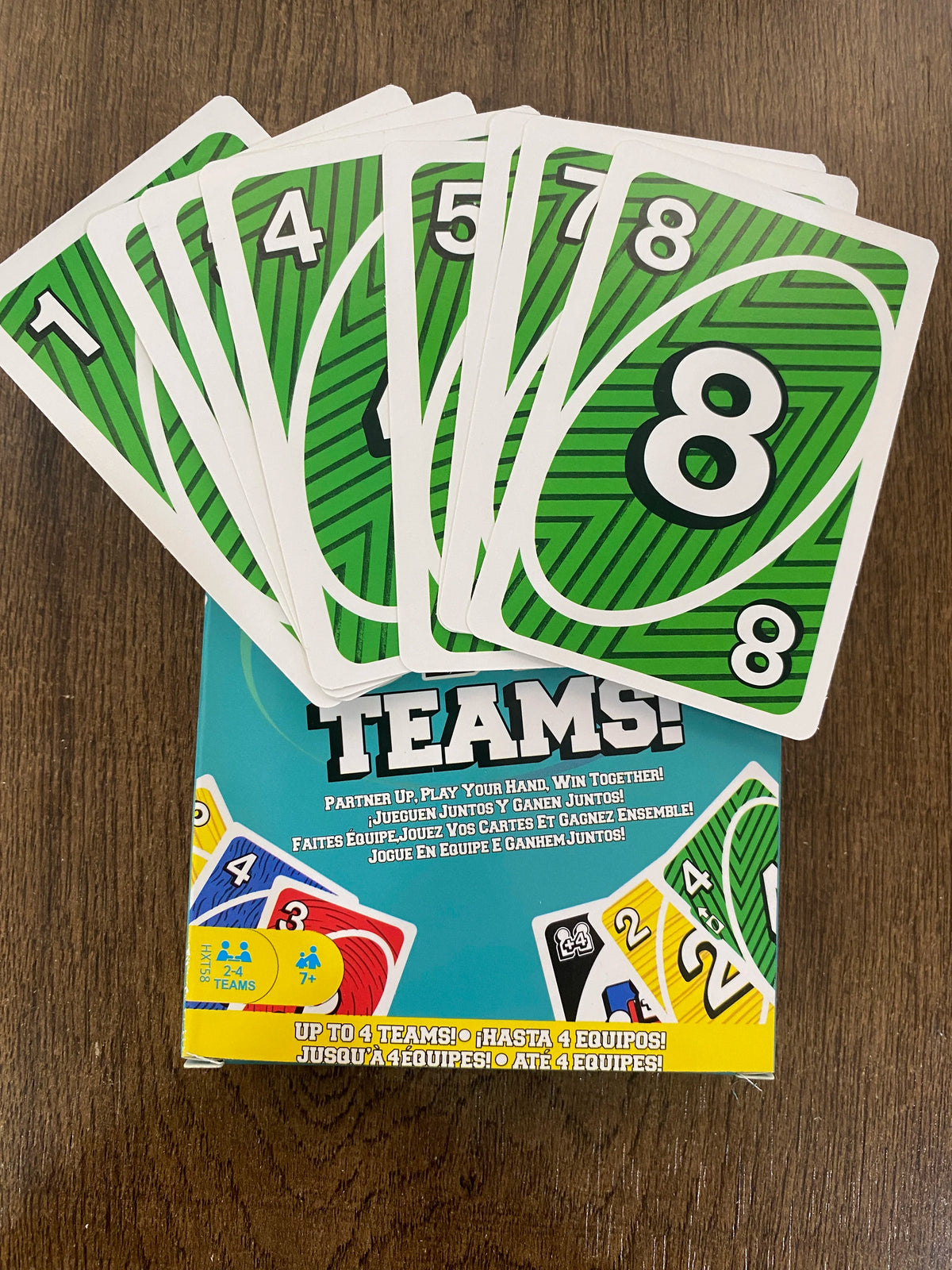 A deck of green and white matching cards is shown next to a box for the FLIP! Fast-Paced Matching Card Game.