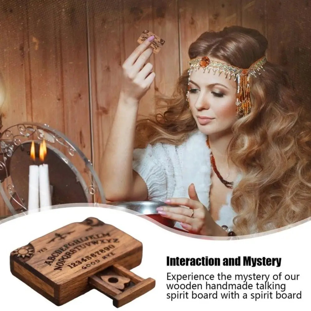 A woman wearing a gold headpiece holds a wooden spirit board with a drawer in front of a fireplace.