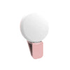A portable LED selfie ring light in a pink casing with a white light diffuser.