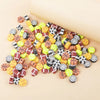 A collection of 100 polymer clay sport ball beads in various colors and patterns for jewelry making