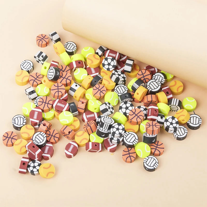 A collection of 100 polymer clay sport ball beads in various colors and patterns for jewelry making