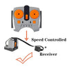 A gray motor and servo set with orange accents, connected by a wire to a receiver.