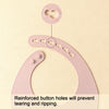 Pink silicone baby bibs showing reinforced button holes for durability