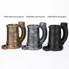 Three versions of a Wolf Crest Cup mug in bronze, silver, and black are displayed.