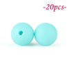 Two light blue silicone beads are shown against a white background.