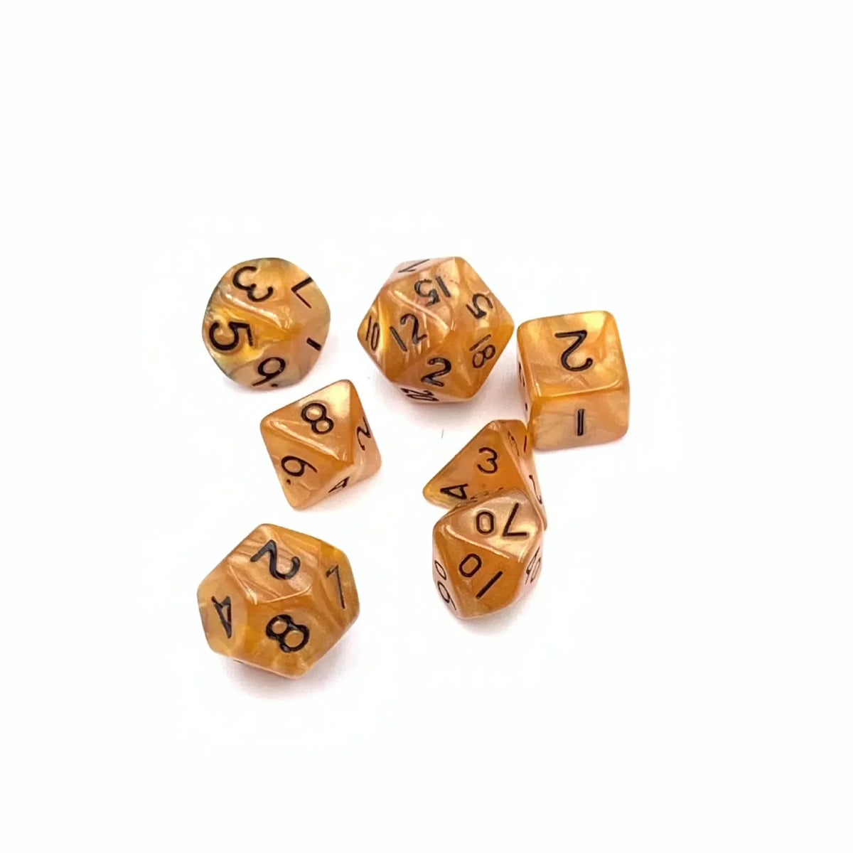 A collection of seven small, amber-colored polyhedral dice scattered on a white background.