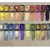 A row of 20 metal watercolor paint colors with pearl finish arranged in small square pots.