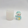 A small, light blue silicone snowman figure with a white hat and scarf is shown next to a white candle.
