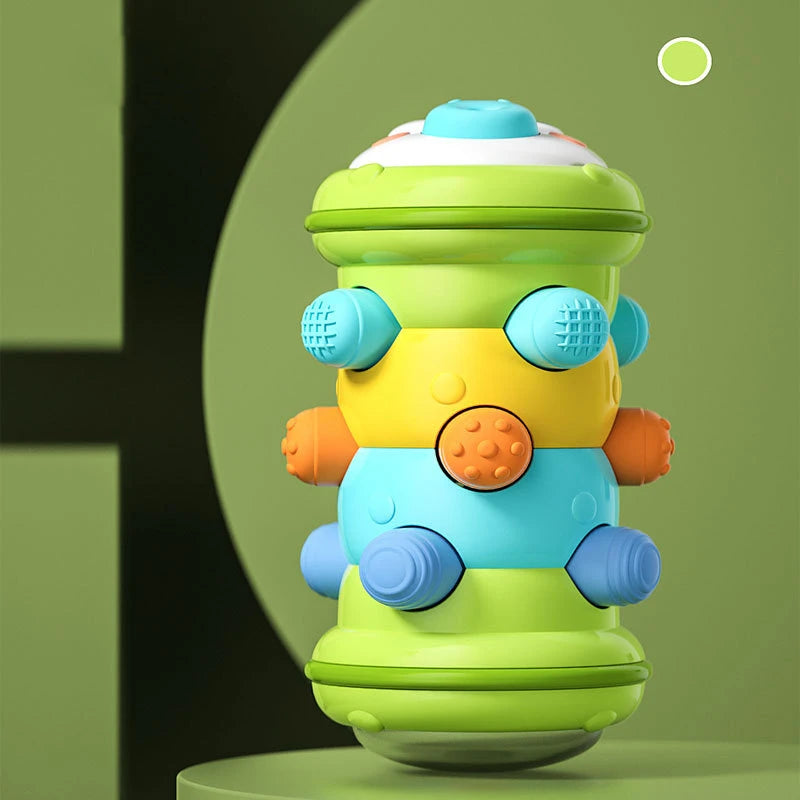 A colorful Montessori baby crawling roller toy with multiple textured spheres in shades of green, yellow, and blue.