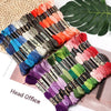 A collection of vibrant embroidery thread skeins in various colors and shades arranged for cross stitch and DIY crafts.