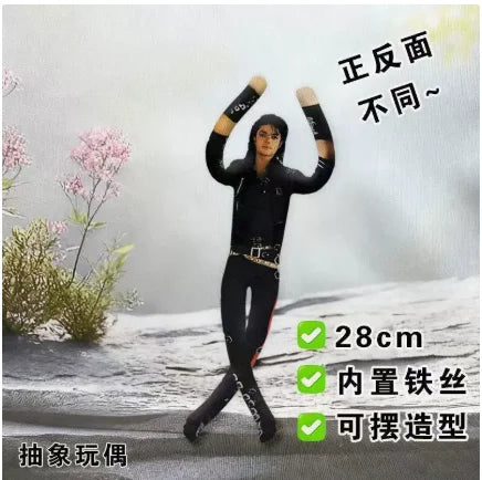 A black poseable plush doll resembling Elvis Presley Cat King, shown in a standing pose against a snowy background.