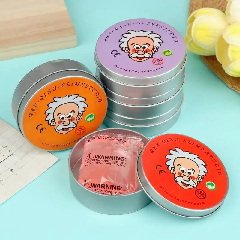 A stack of Wen-Qing Slime Studio containers and an open container of orange slime with a wizard face design.