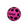 A bright pink foam ball with black polka dots, labeled Moon Ball.