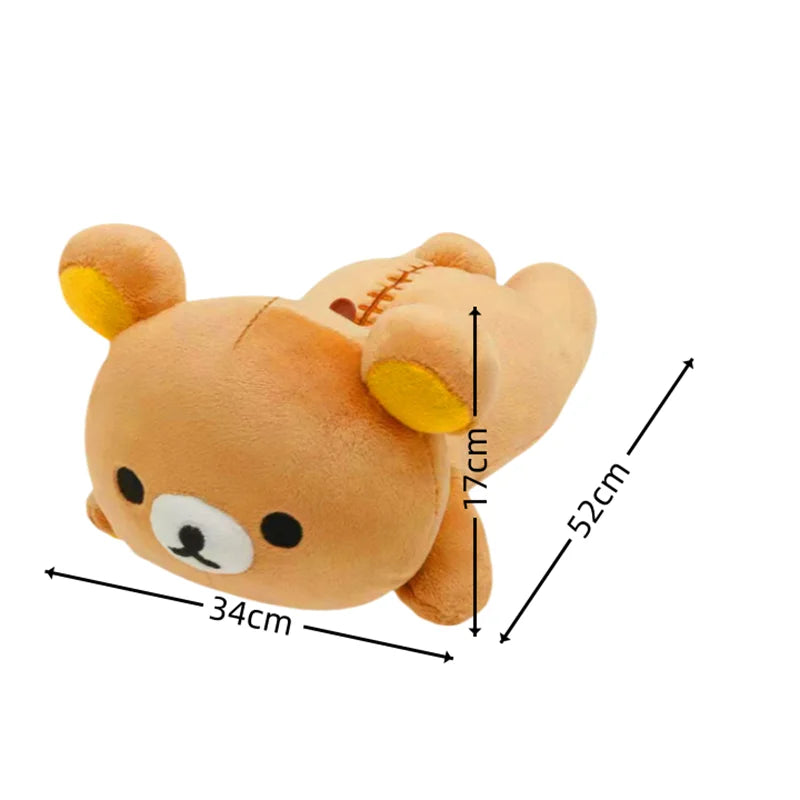 A soft, tan Rilakkuma anime plush bear stuffed toy with yellow ears and stitching details.