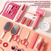 A pink kids hair salon role play set featuring various styling tools like scissors combs brushes and a hairdryer