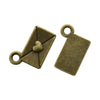 Two antique brass envelope charms with heart accents, used for jewelry making.