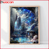 A framed painting depicting a fantastical, glowing blue landscape with waterfalls and ancient ruins.