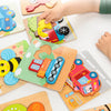 A hand is placing a wooden shape puzzle piece onto a larger wooden board with various colorful shapes for children's learning